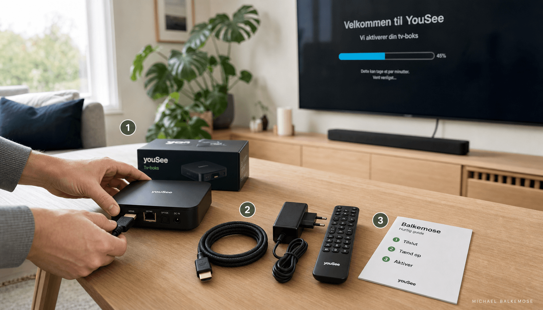 Person tilslutter YouSee tv-boks med HDMI-kabel