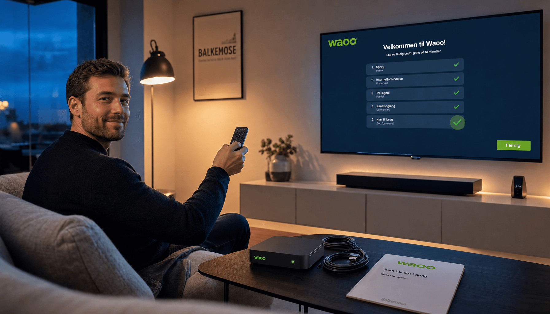 Mand færdiggør Waoo-tv-opsætning med fjernbetjening i stuen